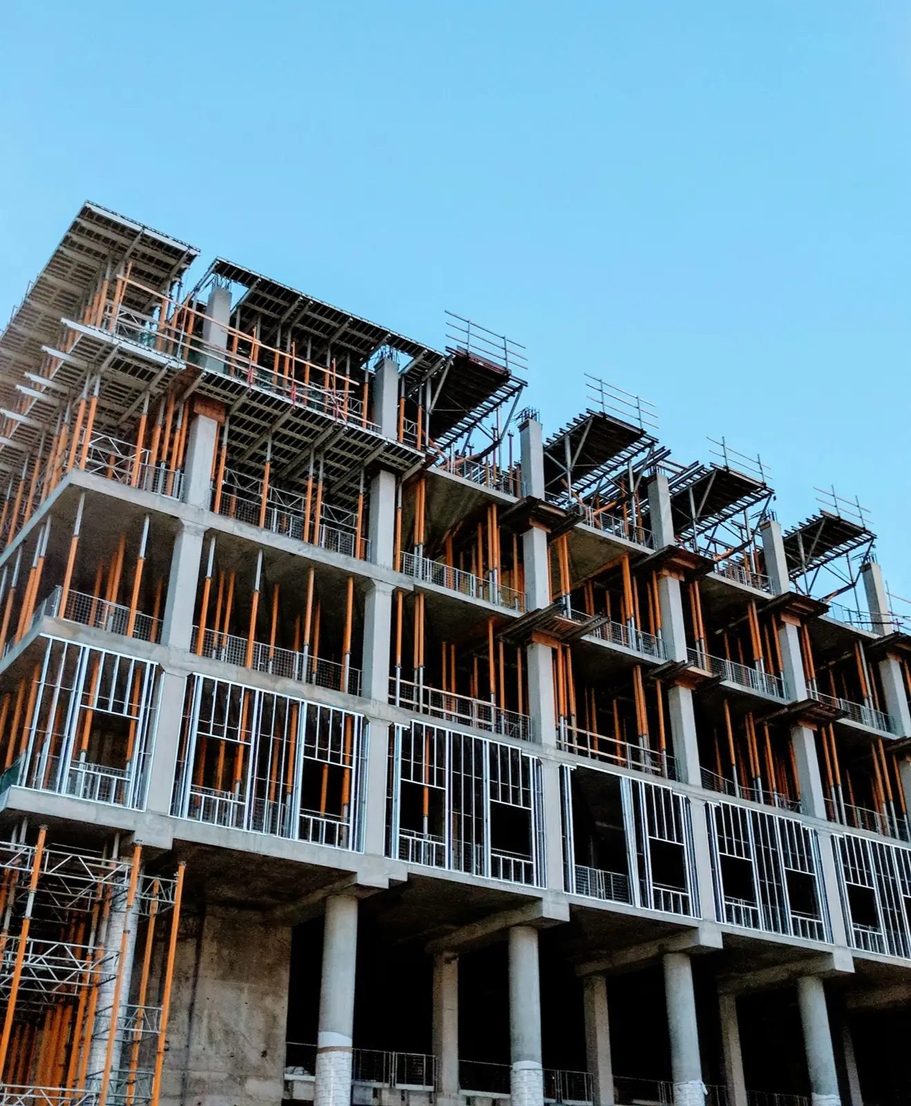Concrete floors under construction with vertical shoring in place